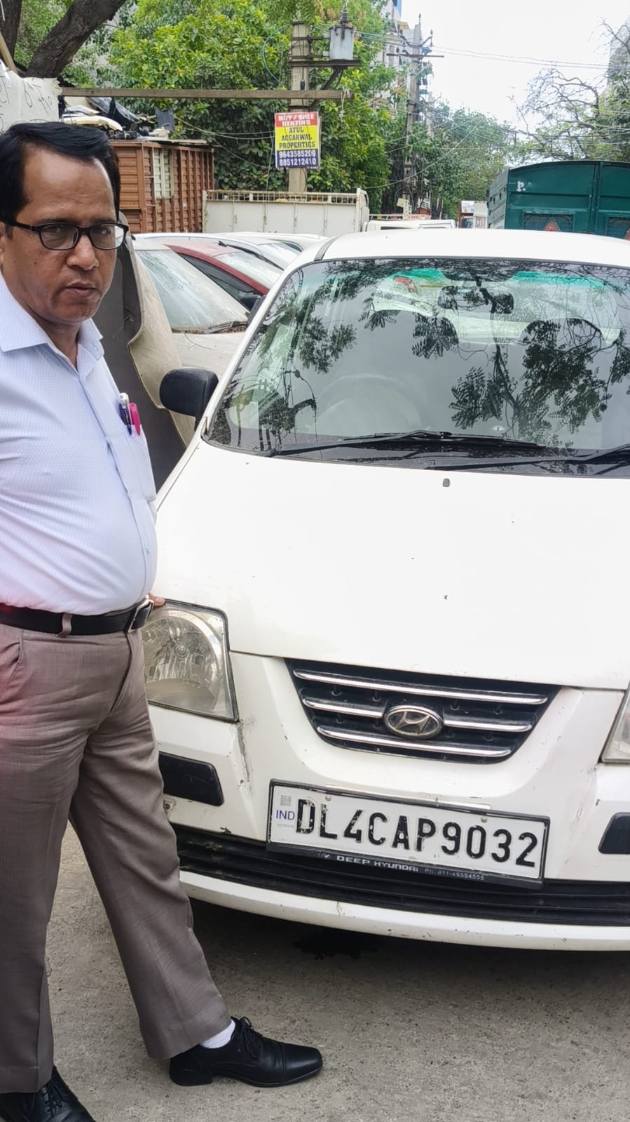 White Hyundai front inspection photo with vehicle number plate