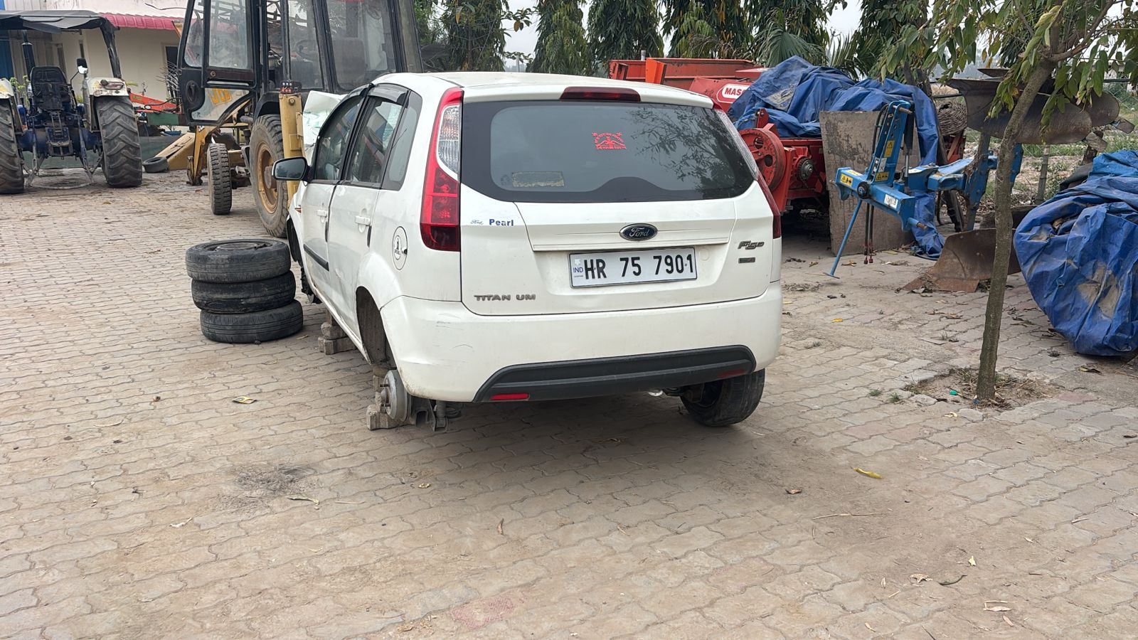 Ford Figo rear view raised on blocks with tyres removed